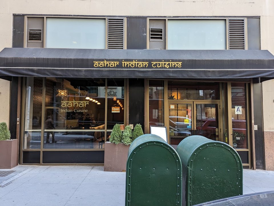 Warm plated Indian dishes on a restaurant table.